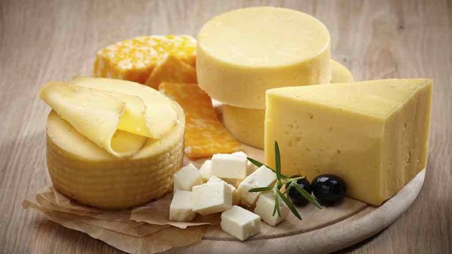 cheeses on round board